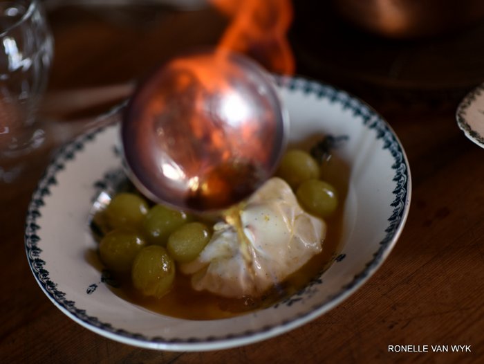 Yoghurt mascarpone cream with Armagnac flambéed grapes.